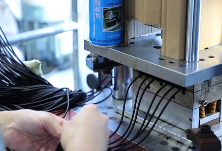 Cable ends loaded into the overmoulding press die